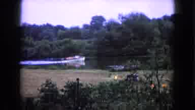 Wauconda Illinois USA (1960): Boat Filled With People With Lifejackets Pass