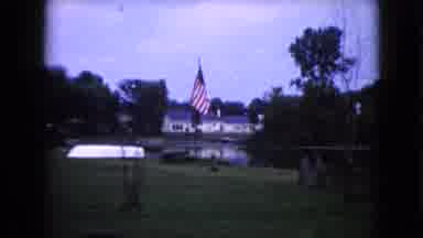 Wauconda Illinois USA (1960): An American Flag Waivers In The Breeze In Front Of A