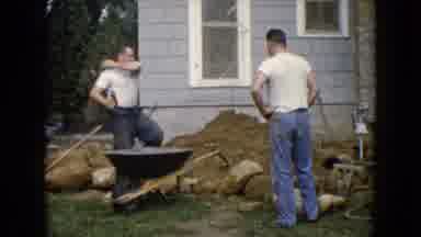 Wauconda Illinois USA (1960): Two Guys Outside Working On The Lawn