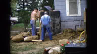 Wauconda Illinois USA (1960): Several Men Stand Outside Of A House With An Unknown