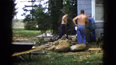Wauconda Illinois USA (1960): Three Men Standing While Working Outdoors In The