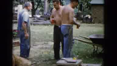 Wauconda Illinois USA (1960): Working Men On Break Then Cut To Them Moving Plants