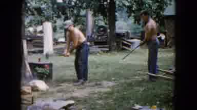 Wauconda Illinois USA (1960): A Man Is Hammering And Breaking A Rock With The