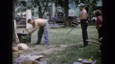 Wauconda Illinois USA (1960): Man Breaks Rocks With Sledgehammer While Another
