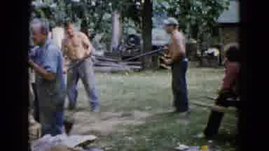 Wauconda Illinois USA (1960): Men Cutting Wood Outside And Holding A Beer And Axe