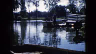 Wauconda Illinois USA (1960): A Man Standing Beside A Small Boat Landed In A Lake