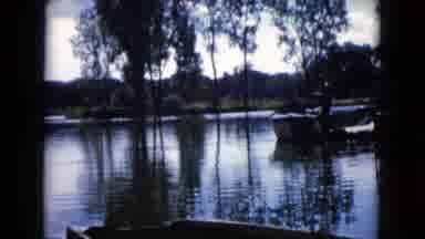 Wauconda Illinois USA (1960): Man Fishing In Lake While Standing Next To A Boat
