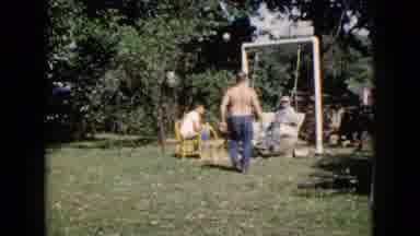 Wauconda Illinois USA (1960): Men Enjoying A Nice Summer Day In The Yard Swinging