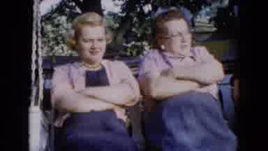 Wauconda Illinois USA (1960): Three Women Swinging On A Wooden Porch Swing While