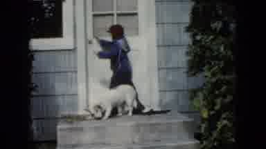 Wauconda Illinois USA (1960): Little Boy With A Dog Trying To Open A Door