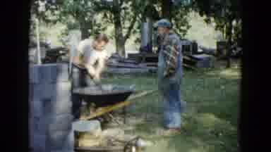 Wauconda Illinois USA (1960): A Mason Is Mixing The Concrete In A Large Vessel