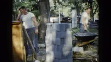 Wauconda Illinois USA (1960): Bricklayers Building Foundation Of A Home While