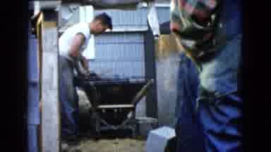Wauconda Illinois USA (1960): A Young Man Is Collecting Concrete Mixture And An