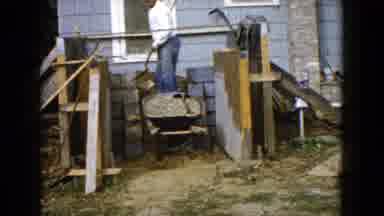 Wauconda Illinois USA (1960): Man Moving Gravel From Wheelbarrow Using A Shovel