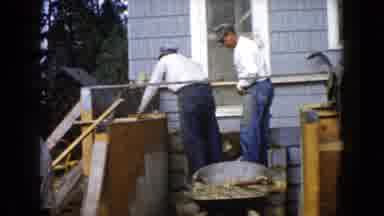 Wauconda Illinois USA (1960): Several Men Work Together To Build Something Behind