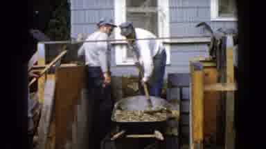 Wauconda Illinois USA (1960): Three Men Outside Shoveling From Wheelbarrow