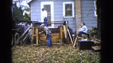 Wauconda Illinois USA (1960): Men At Work Doing Construction On A Home Lawn