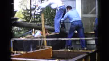 Wauconda Illinois USA (1960): Men Shoveling Fresh Concrete To Pour For A Porch Or