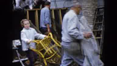 Wauconda Illinois USA (1960): Child Helps Family By Picking Up And Carrying A