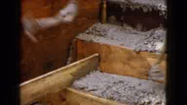 Wauconda Illinois USA (1960): Someone Hammers A Plank Of Wood With Concrete Above