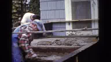 WAUCONDA ILLINOIS USA-1960: Two Men Laying Cement Steps On A Building