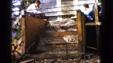 Wauconda Illinois USA (1960): Two Adults Cleaning Up The Remaining Of Something
