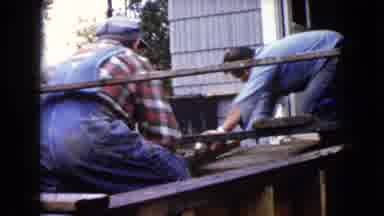 WAUCONDA ILLINOIS USA-1960: Three Men Working On Porch With Wet Concrete