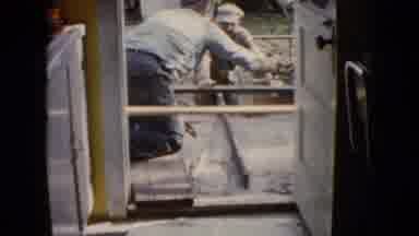 Wauconda Illinois USA (1960): Two Men Laying Wet Cement Outside Doorway Use Tools