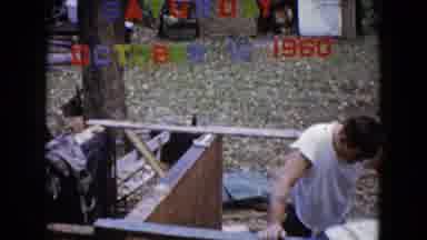 Wauconda Illinois USA (1960): Man In White Tank Top Builds A Shelf