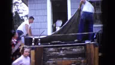 Wauconda Illinois USA (1960): Two Men Are Spreading A Tarpaulin Over Something In