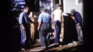 Wauconda Illinois USA (1960): Men Gather Garden Moving Heavy Wood Furniture
