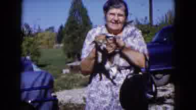 Wauconda Illinois USA (1960): A Lady Holding A Cute Little Dog