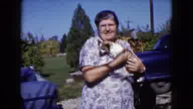 Wauconda Illinois USA (1960): Two People Sitting Take Turns Holding And Petting A