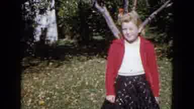 Wauconda Illinois USA (1960): Girl Standing In Grass Watching Cars Drive Down Road