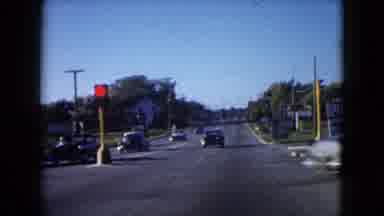 Wauconda Illinois USA (1960): Old Vintage Cars Driving On The Road On Sunny Day