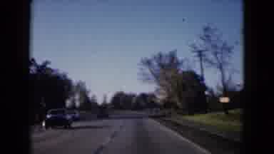 Wauconda Illinois USA (1960): A Car Travelling On A Road And Filmed By Someone In