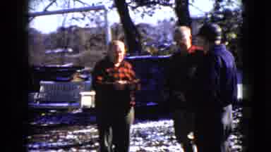 Wauconda Illinois USA (1960): Three Old Men Exchange White Papers Outside In Snow