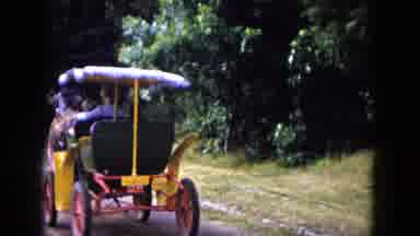 Buffalo New York USA (1961): People Riding In Horse Drawn Carriages Down Paved