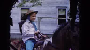 Buffalo New York USA (1961): Little Girl Riding A Brown Horse Meanwhile A Man Was