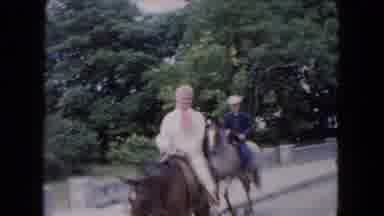 Buffalo New York USA (1961): Two People Riding Brown And White Horses Next To A