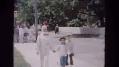 Buffalo New York USA (1961): Two Children Strolling With Woman In White Along A