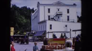 Buffalo New York USA (1961): Horse-Drawn Wagons Sit In A Street In Front Of A