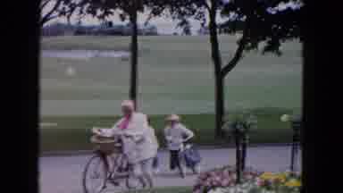Buffalo New York USA (1961): People Pushing Their Bicycles Up The Hill
