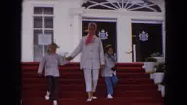 Buffalo New York USA (1961): Woman And Two Children Walking Down Red Stairs In