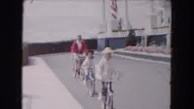 Buffalo New York USA (1961): Two Young Girls And A Man Slowly Riding Their