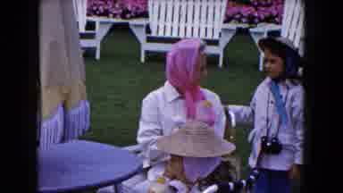 Buffalo New York USA (1961): Old Lady Offers Very Young Lady A Drink And Snickers