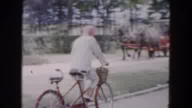 Buffalo New York USA (1961): Person In Bandanna Riding A Two Seat Bicycle Alone On