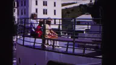 Buffalo New York USA (1961): Blonde Woman On A Bench Sits Next To Boy In A Red