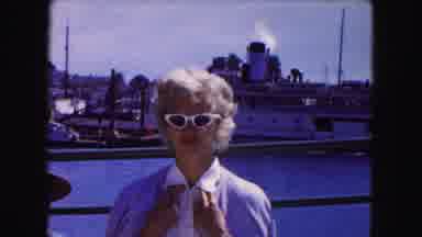 Buffalo New York USA (1961): Woman Wearing White Sunglasses Stands In Front Of