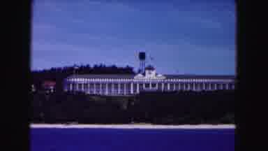 Buffalo New York USA (1961): A White Building With Gray Roof Showing A Water Tower